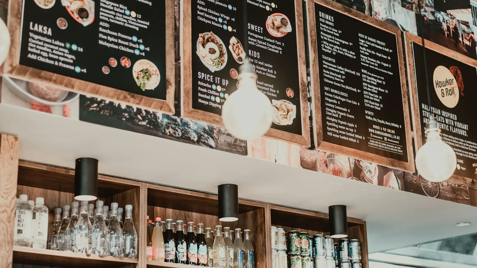 Menu boards hanging above the bar of a restaurant