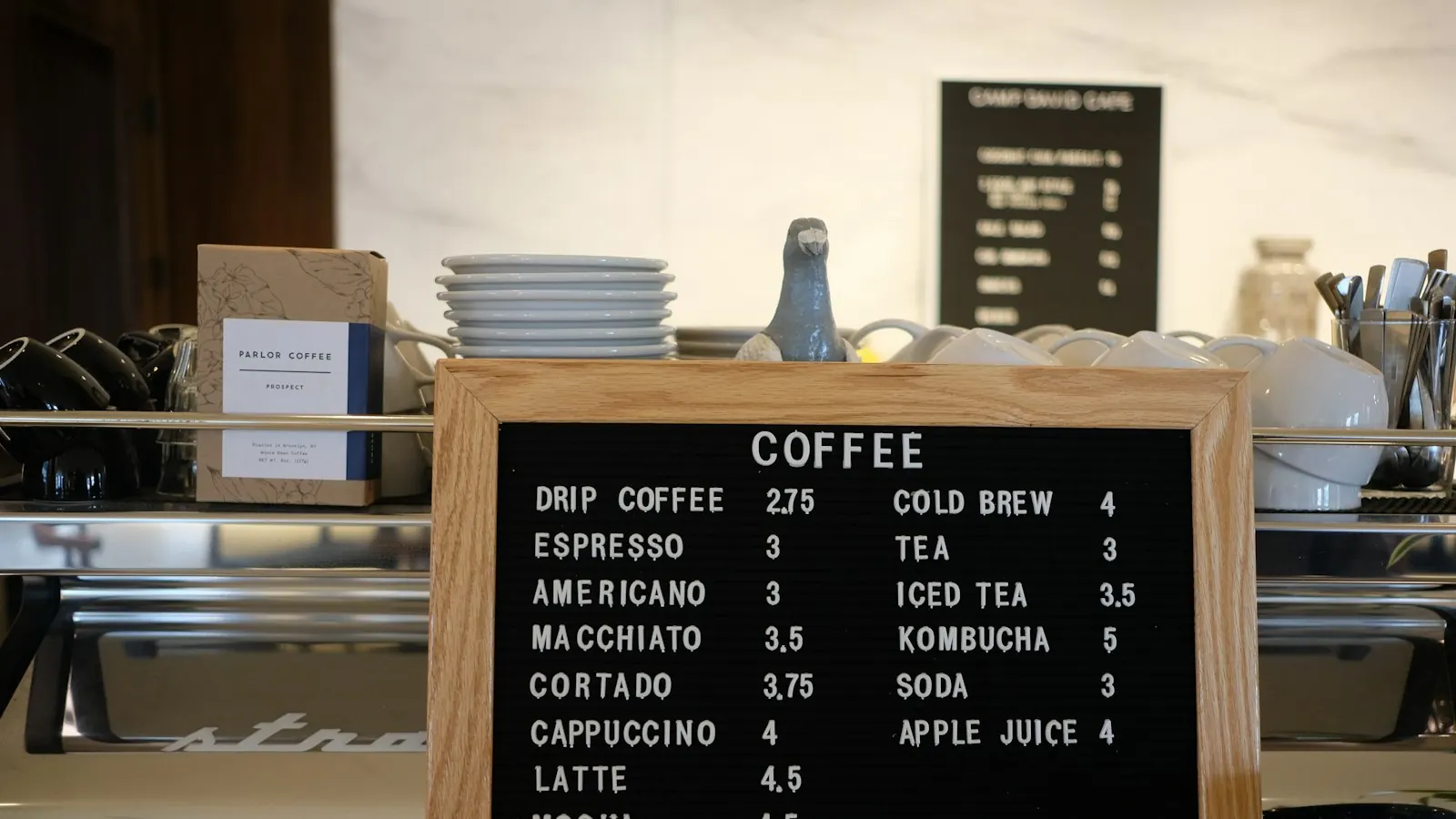 A simple coffee menu board on a café counter